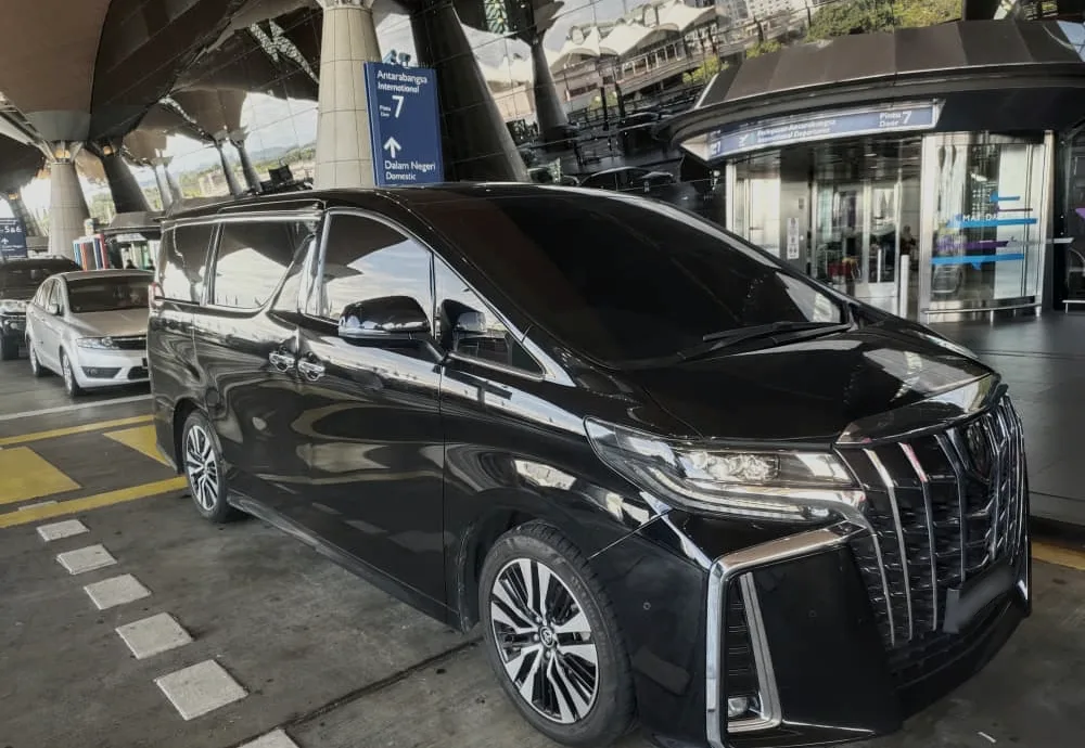 BH Chauffeur MPV at the airport departure kerb