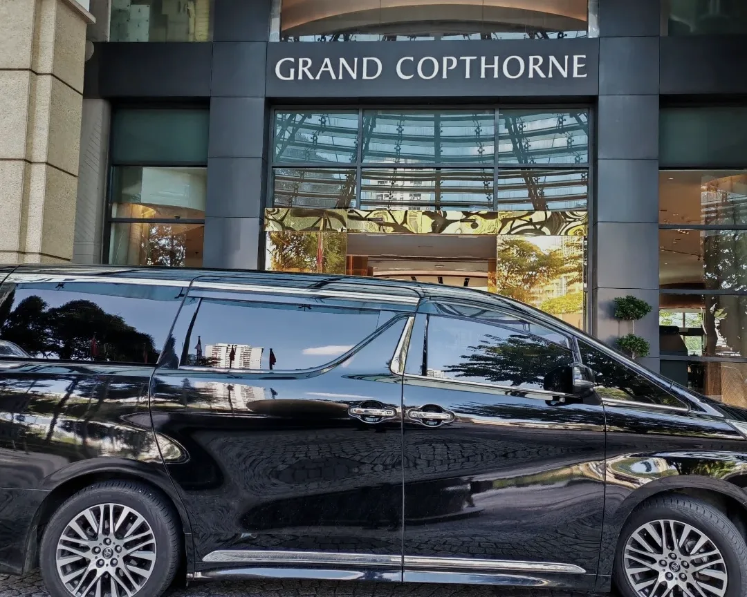 BH Chauffeur MPV outside a hotel entrance