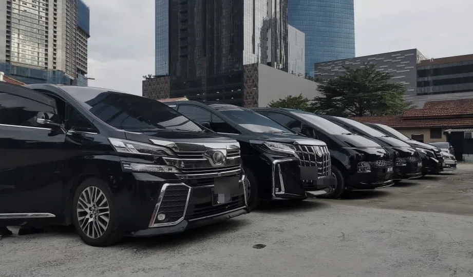 A row of BH Chauffeur MPVs